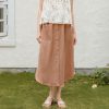 A fashionable brown midi skirt featuring button-down front and large pocket, perfect for everyday wear. Stylish and comfortable, ideal for spring and summer casual outfits.