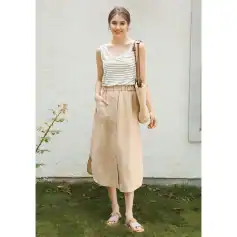 Stylish summer outfit for women with casual beige skirt and striped tank top, perfect for warm weather, shopping, and outdoor outings.