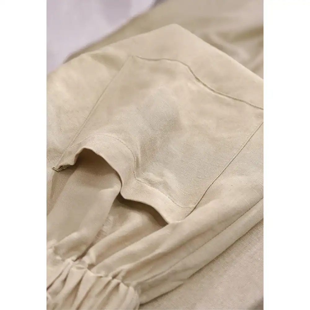 Comfortable beige medical scrubs with functional pocket, ideal for doctors and nurses seeking medical attire.
