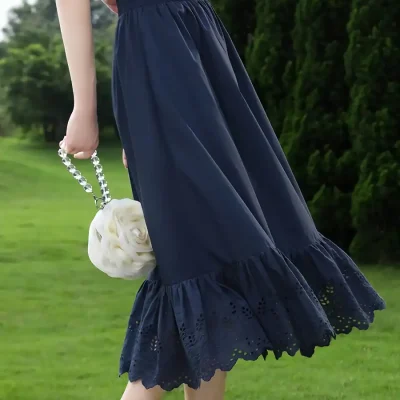 Elegant navy midi skirt with eyelet lace hem for women.