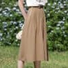 Stylish beige wide-leg trousers with pleats, high waist design, and a relaxed fit, ideal for casual, office, or trendy everyday outfits, offering comfort and sophistication.