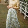 Stylish women's yellow floral maxi skirt, perfect for casual and summer wear, made from lightweight, breathable fabric for comfort and style.