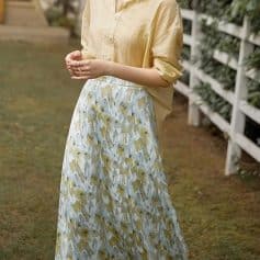 Stylish women's yellow floral maxi skirt, perfect for casual and summer wear, made from lightweight, breathable fabric for comfort and style.