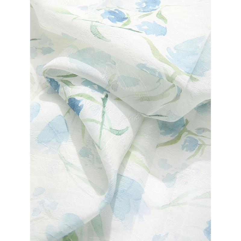 Luxurious white bedding with pastel blue and green floral patterns, perfect for a fresh, serene bedroom decor. Soft, breathable fabric for ultimate comfort.