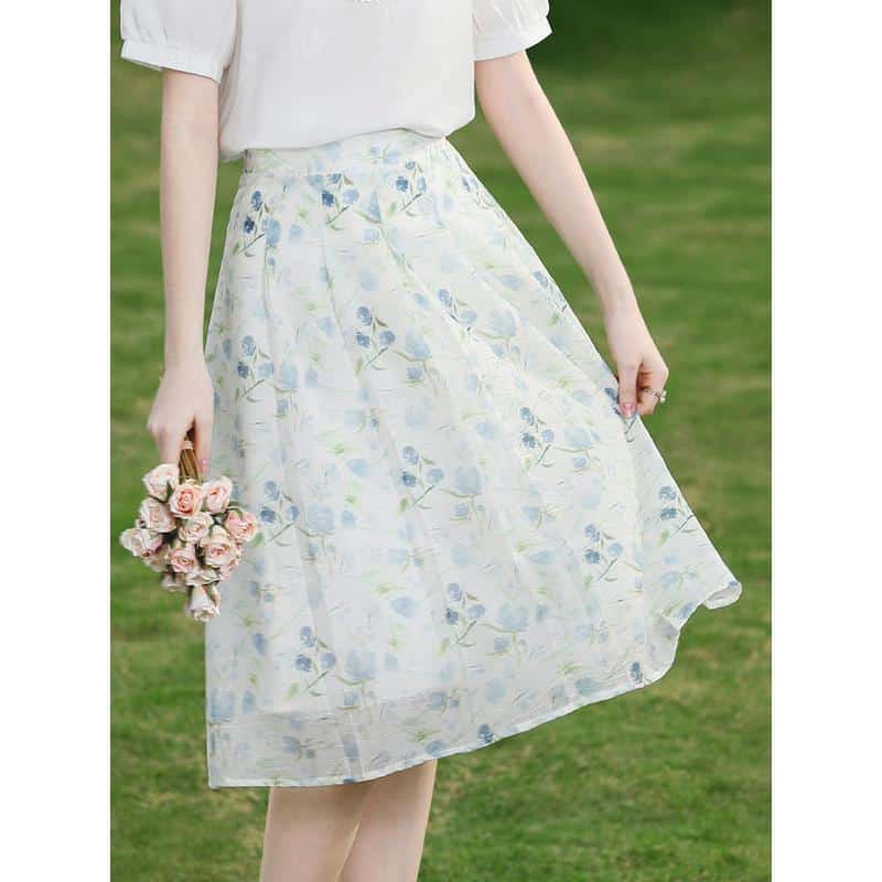 Floral midi skirt for women, perfect for spring and summer casual wear, featuring a flowy design with pastel colors and a comfortable fit.