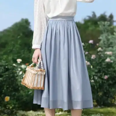Bright, stylish blue midi skirt ideal for casual and dressy occasions, made from comfortable fabric with an elastic waistband for a perfect fit.