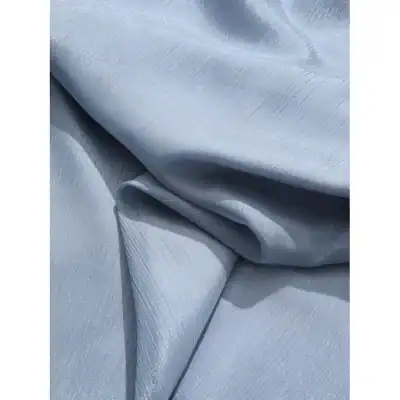 High-quality, luxurious blue silk fabric ideal for premium cosmetic and skincare product packaging, offering a smooth and shiny surface to enhance product presentation.