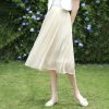 Light beige pleated midi skirt perfect for casual or semi-formal occasions. Comfortable fit with flowy design, ideal for spring and summer wear.