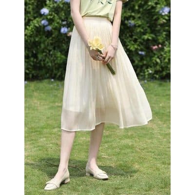 Stylish cream midi skirt for women, crafted from lightweight fabric, perfect for casual or formal occasions, offering comfort and elegance in spring and summer.