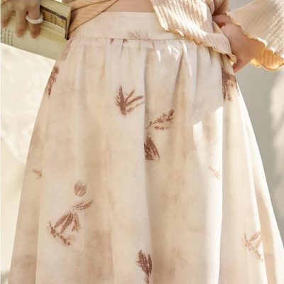Soft beige skirt with brown botanical print, perfect for casual and elegant looks, available at Monalisa Medical Store.