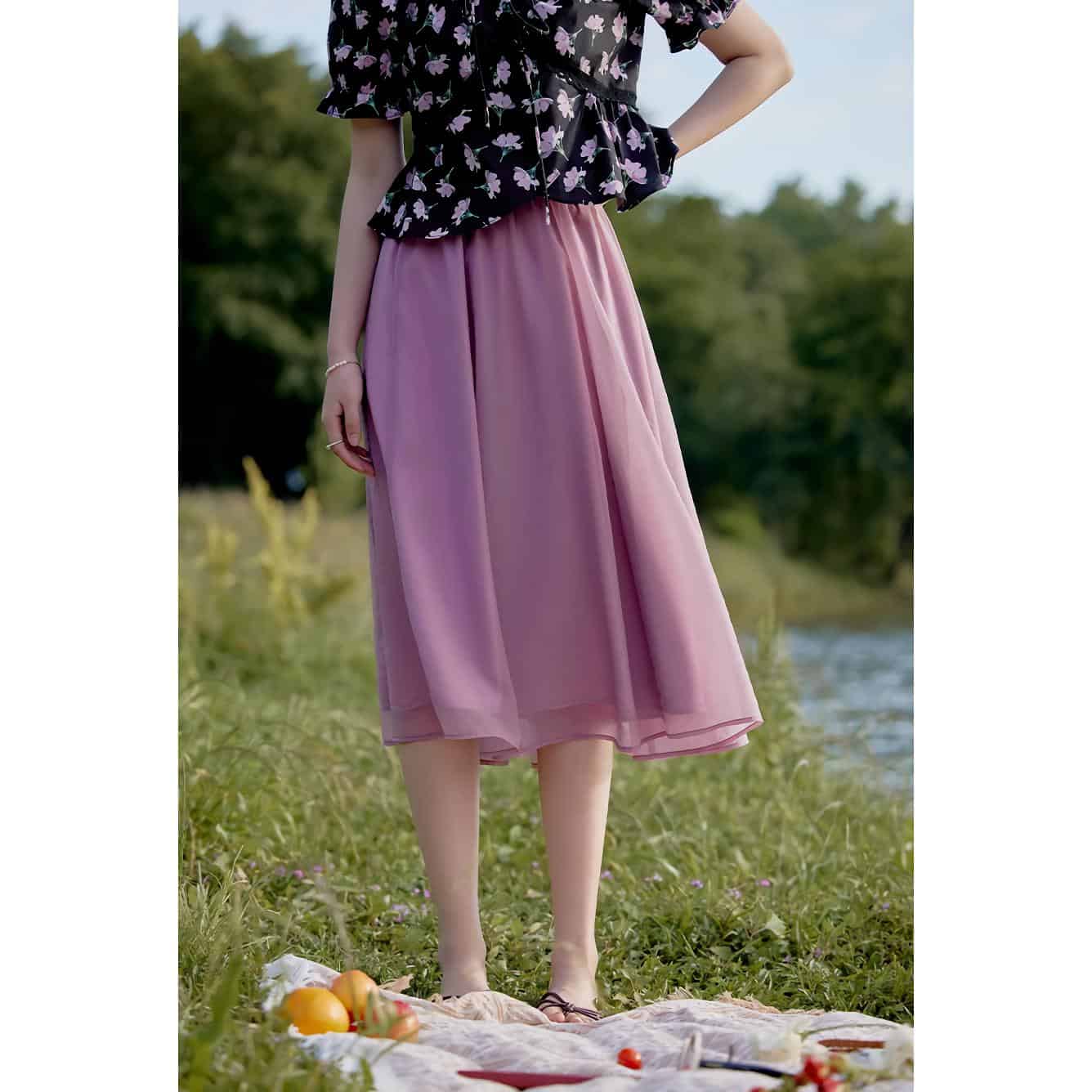 Comfortable, flowy pink tulle skirt perfect for casual or outdoor occasions, paired with a floral blouse. Ideal for stylish women seeking affordable fashion options from Monalisa Medical.