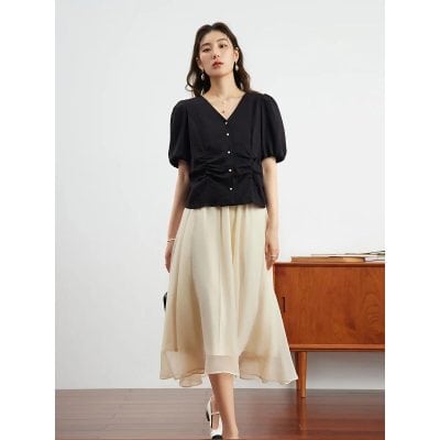 Stylish women's dress featuring button details, puff sleeves, and a flattering fit, perfect for office or casual wear.