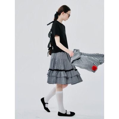 Women wearing trendy glasses in a stylish, minimalist setting for fashionable eye care.