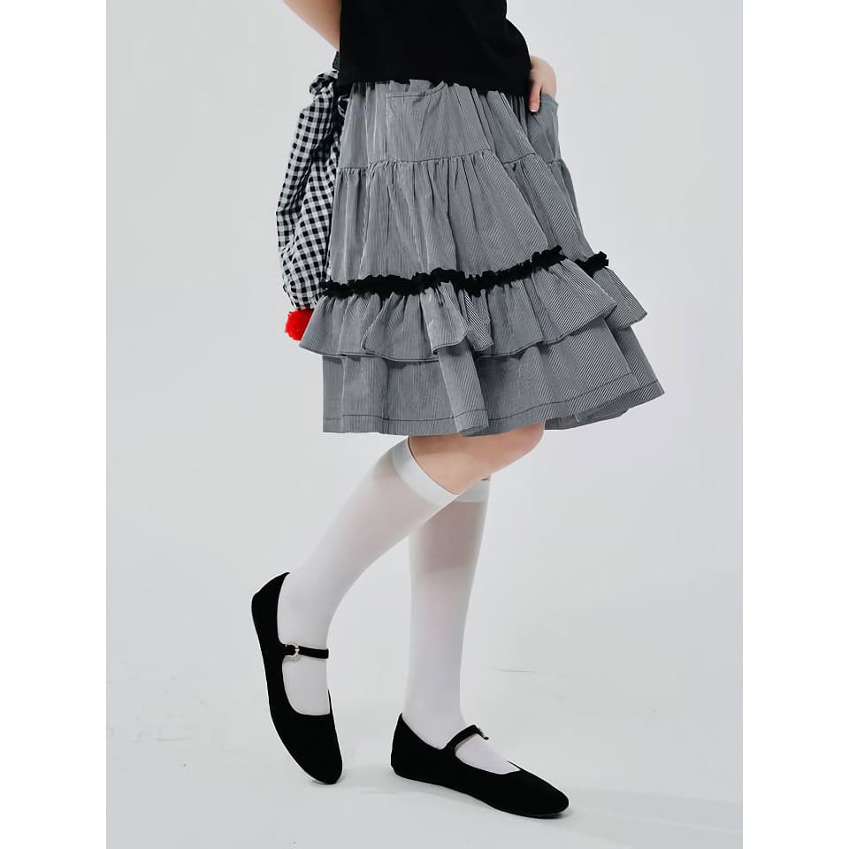 Stylish gray and black pleated skirt with layered ruffles, perfect for school or casual wear. Comfortable fit with a trendy design, ideal for fashion-forward students.