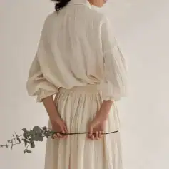 High-quality beige blouse and matching skirt, perfect for women seeking sophisticated fashion. Designed with comfortable fabric and stylish details for versatile outfits.