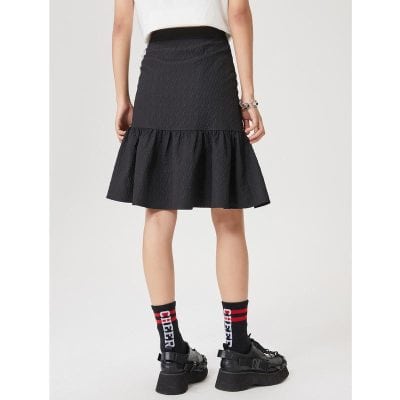 A stylish black skirt with textured fabric and ruffled hem, perfect for fashionable women looking for trendy and comfortable clothing options.