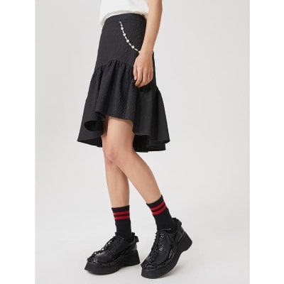 Stylish black textured skirt with ruffle hem, ideal for casual and dressy looks, showcasing trendy fashion and high-quality material.