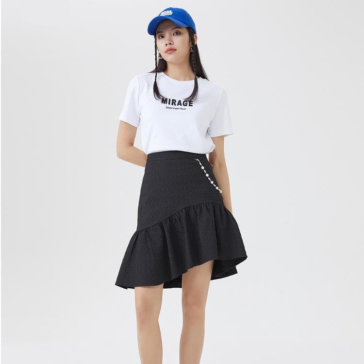 Stylish young woman wearing casual city fashion with white t-shirt, black ruffled skirt, and blue cap. Perfect local fashion look from Monalisa Store for trendy daily wear.