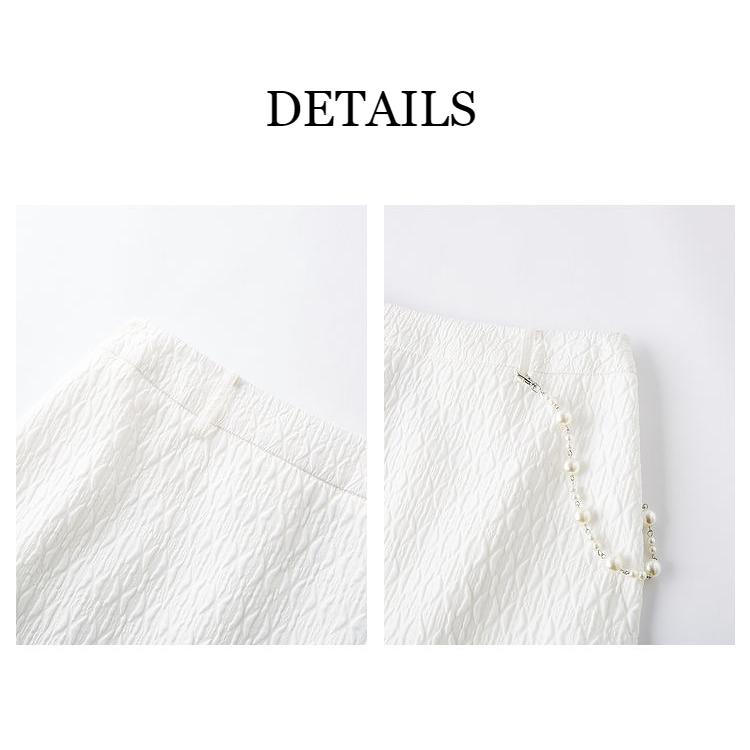 High-quality white textured skirt featuring a stylish pearl necklace, perfect for chic, modern fashion. Ideal for women seeking trendy, elegant clothing and accessories from Monalisa Store.