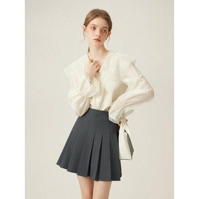 Elegant women's fashion blouse with lace details, perfect for stylish outings and formal occasions.