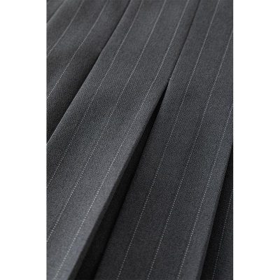 Detailed close-up of elegant black pinstripe suit fabric for professional business attire. Perfect for tailored suits, formal wear, or custom clothing designs. High-quality textile showcased with fine pinstripe pattern.