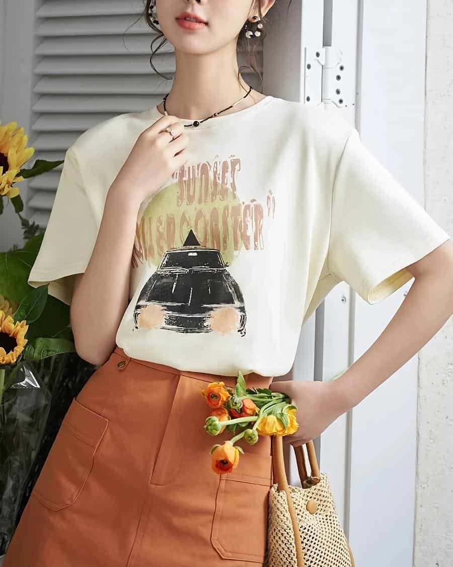 Stylish casual beige t-shirt featuring a camera illustration and "Sunset Photography" text, perfect for everyday wear at Monalisa Store.