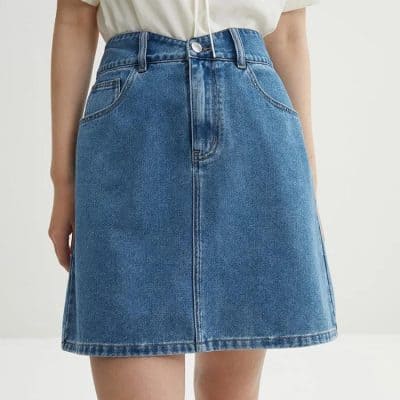 Comfortable high-waisted blue denim skirt for women, perfect for casual and stylish everyday wear. Features classic pockets and trendy A-line design.