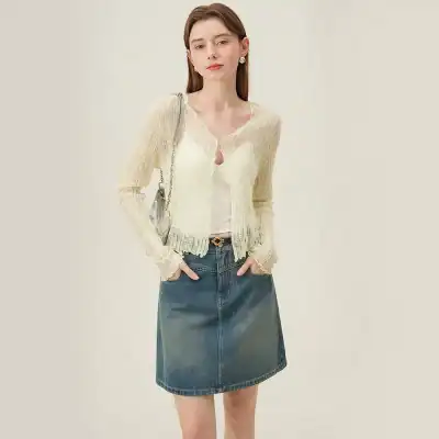 Elegant women's ivory knit cardigan with ribbed detailing and button closure, perfect for spring and fall outfits.