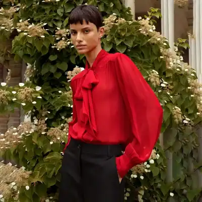 Elegant red blouse with bow detail, perfect for stylish office wear or evening outings. Crafted for comfort and sophistication, available at Monalisa Store.