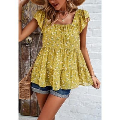 Bright yellow floral sleeveless ruffle top for women, perfect for casual summer looks. Features tiered layers, comfortable fit, and stylish design, ideal for outdoor outings or everyday wear.