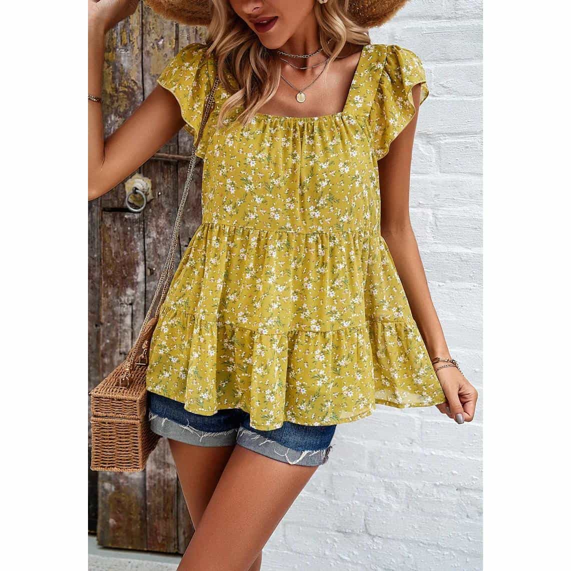 Bright yellow floral sleeveless ruffle top for women, perfect for casual summer looks. Features tiered layers, comfortable fit, and stylish design, ideal for outdoor outings or everyday wear.
