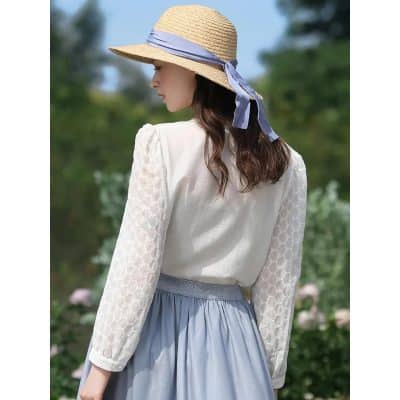 Wide-brim straw sun hat with navy ribbon, perfect for outdoor sun protection and fashion.