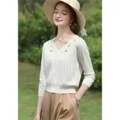 Bright white blouse with delicate embroidery and floral accents, perfect for summer and casual chic looks. Made from lightweight fabric, suitable for all-day comfort.