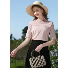 Stylish wide-brimmed straw hat paired with a glamorous pearl-embellished handbag, perfect for fashion-forward women seeking trendy accessories from Monalisa Store.