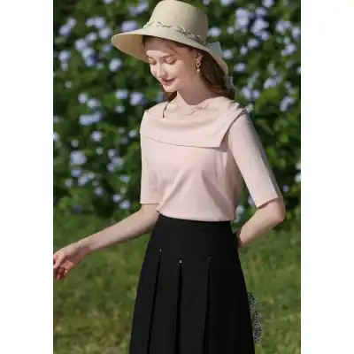 Stylish women's soft pink blouse with a unique neckline, perfect for casual or semi-formal wear, from Monalisa Store.
