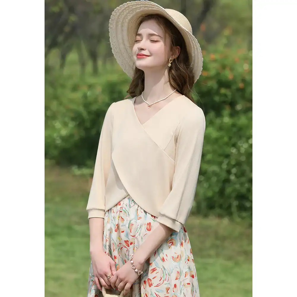 Beautiful woman wearing summer hat, casual dress, and jewelry outdoors, showcasing trendy summer fashion and accessories perfect for warm weather.