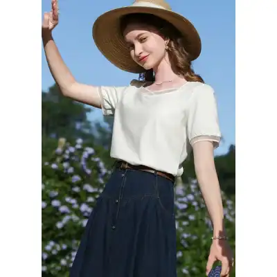 Women’s stylish summer fashion look with blouse, wide-brim hat, and denim skirt, perfect for outdoor sunny day wear. Shop trendy women's clothing at Monalisa Store.