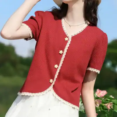 An image of a stylish red optic top with lace trim and floral buttons, perfect for a fashionable and comfortable look. Ideal for casual wear and outdoor outings.