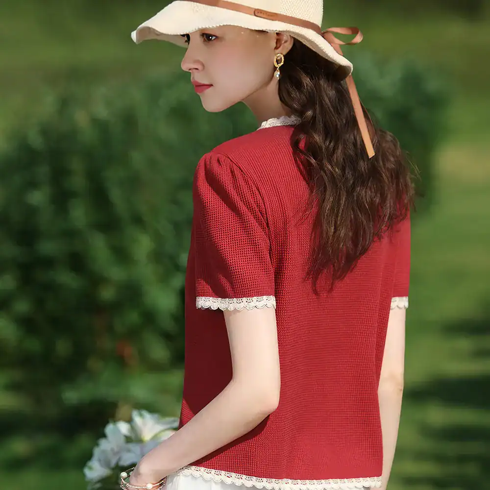 Stylish red women's top featuring lace trim on sleeves and hem, perfect for summer outings. Made with lightweight, breathable fabric for comfort and style, ideal for fashion-conscious women.