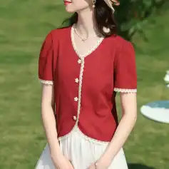 Red blouse with lace-edged neckline and sleeves, floral buttons, perfect for stylish women seeking trendy fashion.
