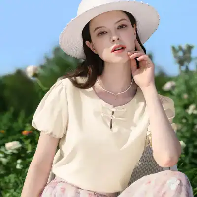 Stylish wide-brim hat and light-colored blouse for women, perfect for outdoor sun protection and summer fashion. Elegant accessories from Monalisa Store enhance your sunny-day outfits.
