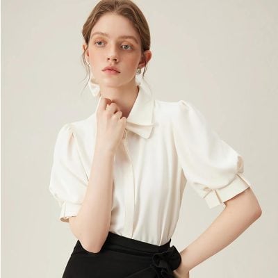 Stylish white women's blouse with puff sleeves, perfect for professional or casual wear, available at Monalisa Store.