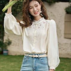 Women’s stylish white embroidered blouse, perfect for casual and semi-formal occasions, offering comfort and elegant design.