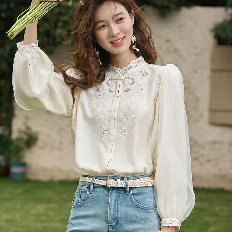 Women’s stylish white embroidered blouse, perfect for casual and semi-formal occasions, offering comfort and elegant design.
