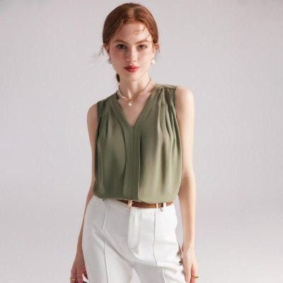 Elegant sleeveless olive green blouse for women, perfect for casual or formal occasions. Made with high-quality fabric, offering a comfortable fit and chic look.