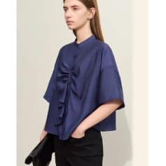Stylish women's navy blue blouse with a ruffle front and relaxed fit, perfect for office or casual wear. Made from high-quality fabric for comfort and durability.