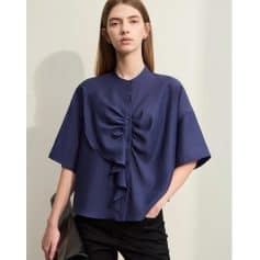 Elegant women's blue blouse with ruffle detail, perfect for office or casual wear, available at Monalisa Medical Store.