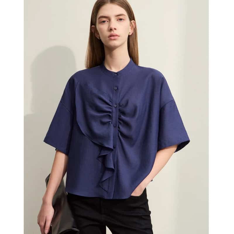 Elegant women's blue blouse with ruffle detail, perfect for office or casual wear, available at Monalisa Medical Store.