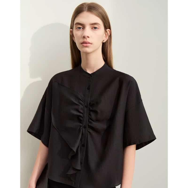 Elegant black women’s blouse with ruffled front detail, stylish and comfortable, perfect for professional or casual wear.