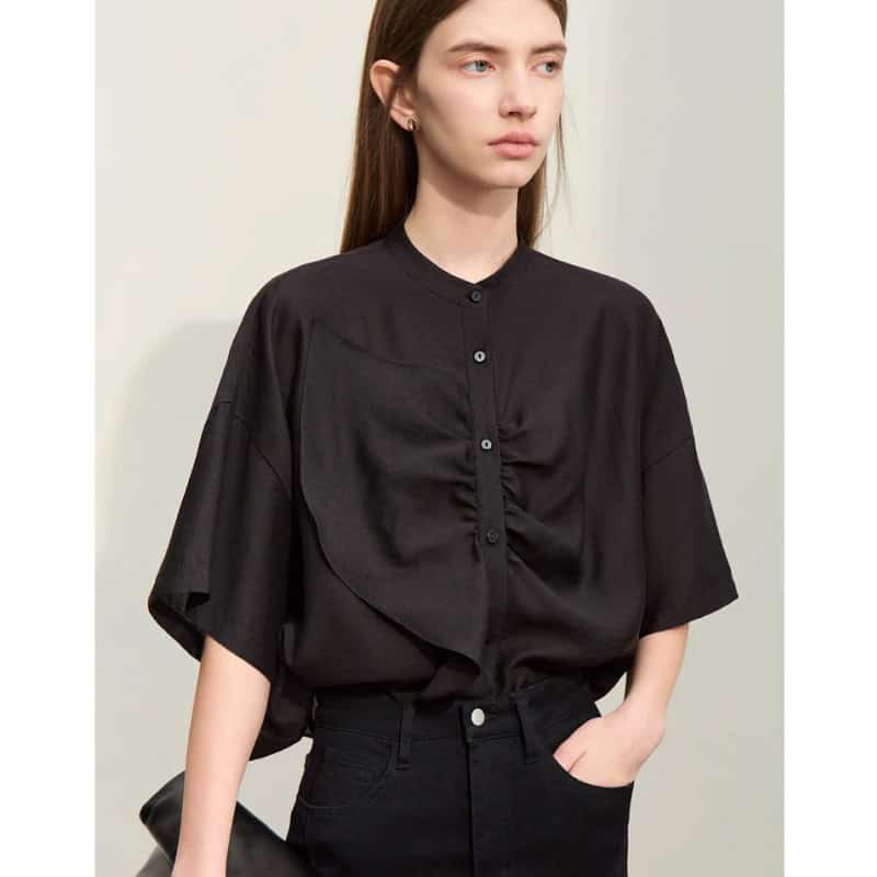High-quality black women's blouse with a trendy design, button-up front, and comfortable fit, perfect for office or casual wear.